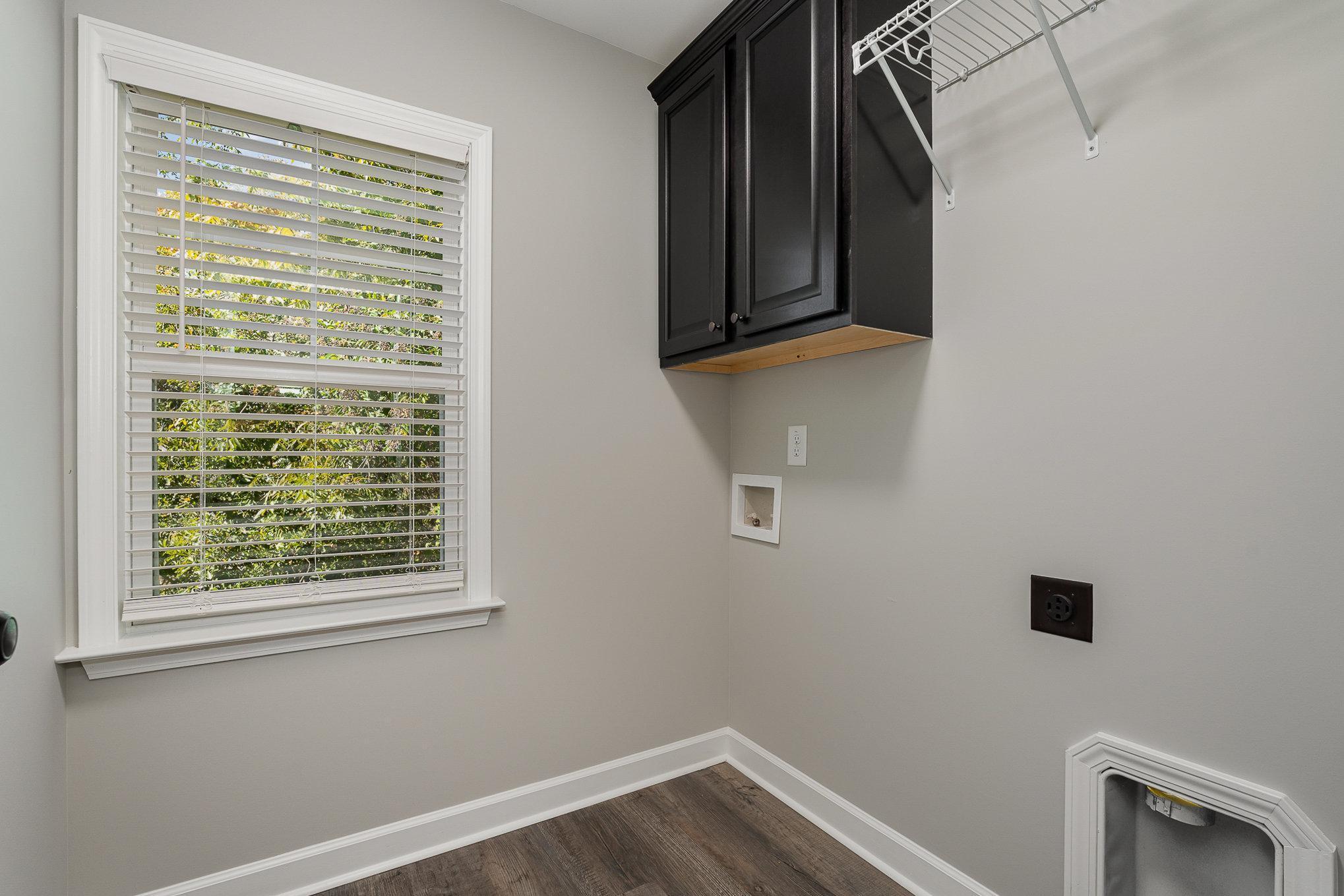 407 East 3rd Street Princeton, NC 27569 - Photo 15 of 18 a view of a closet area with wooden floor and a window