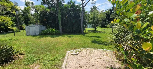 a backyard of a house with lots of green space