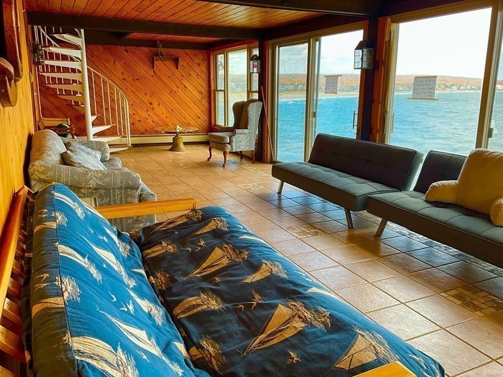 230 Manomet Point Road Plymouth, MA 02360 - Photo 15 of 15 a living room with furniture and floor to ceiling windows