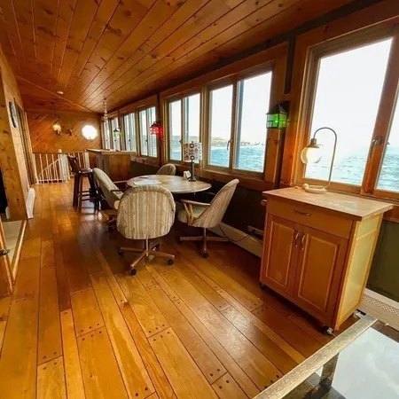 a large bed sitting in a bedroom next to a window