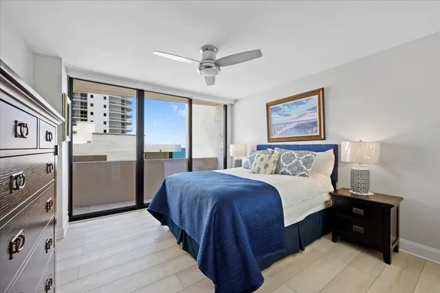 a bedroom with a bed and a refrigerator