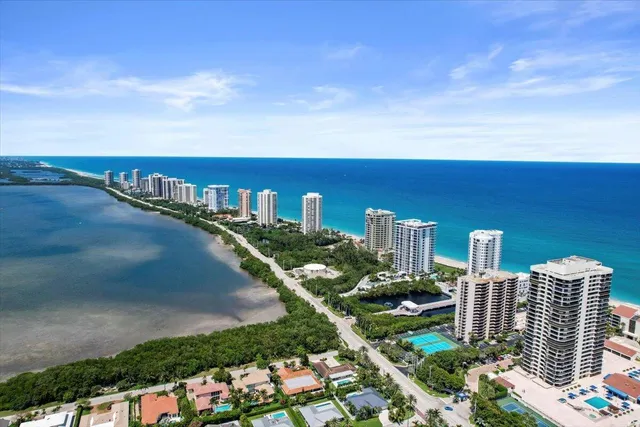 a view of balcony with wooden floor and lake view