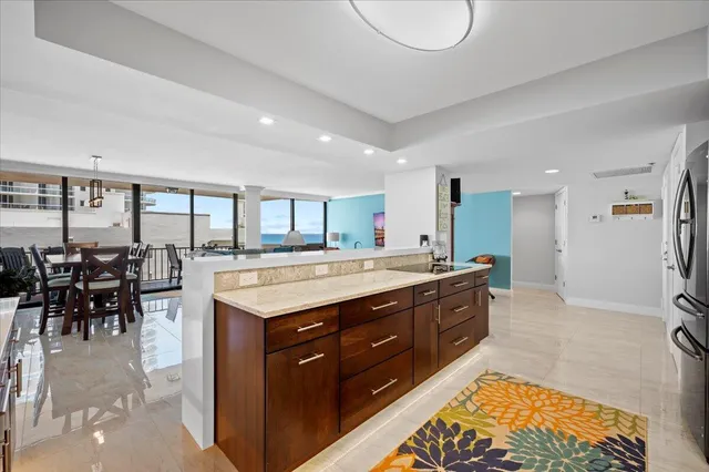 a spacious bathroom with a granite countertop sink and a large mirror