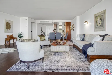 a living room with furniture a rug and a couch