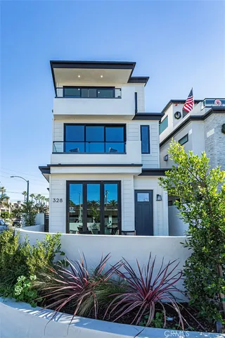 a view of house with outdoor space and balcony