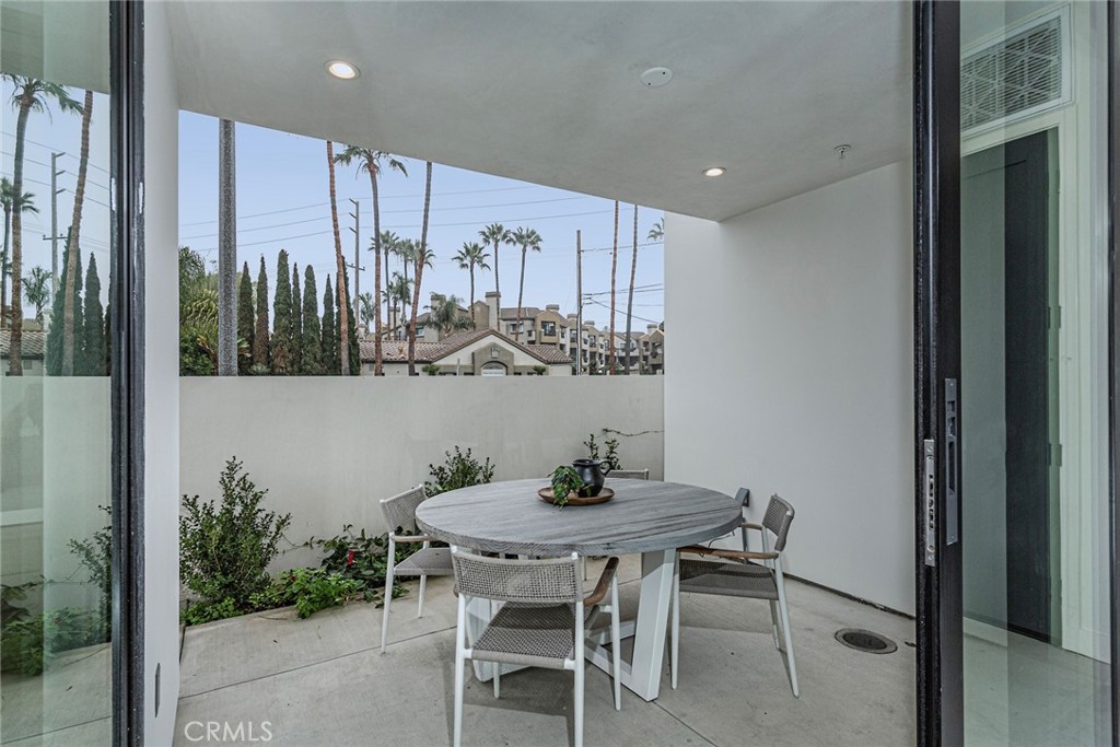328 3rd Street Huntington Beach, CA 92648 - Photo 13 of 42 a view of a dining room with furniture and wooden floor