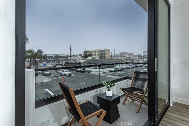 a view of a balcony with chairs