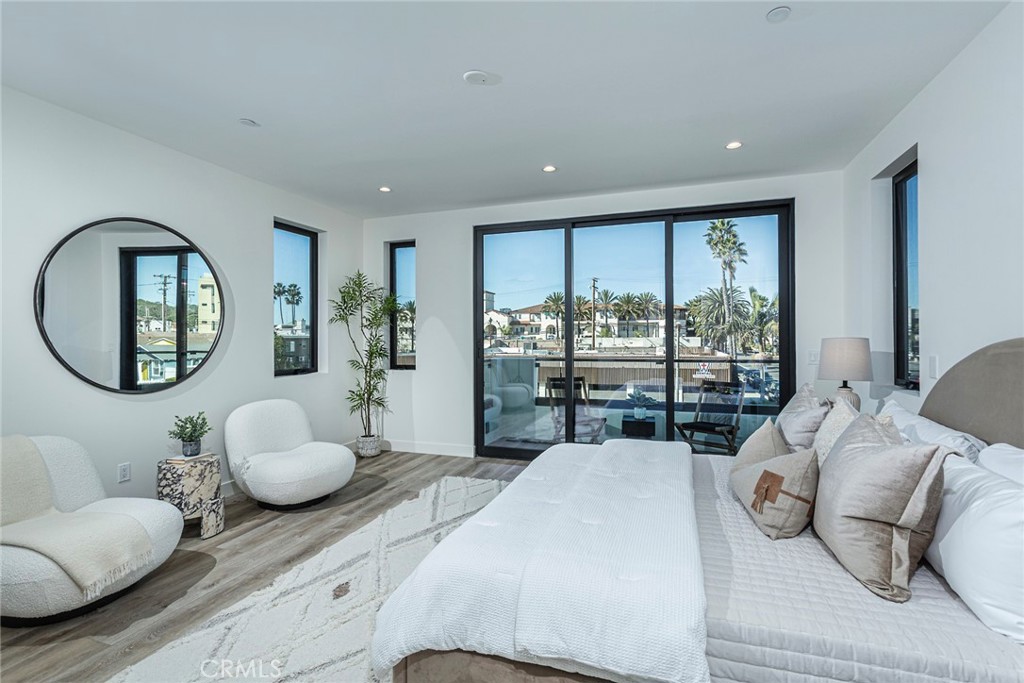 328 3rd Street Huntington Beach, CA 92648 - Photo 19 of 42 a bedroom with furniture and a large window