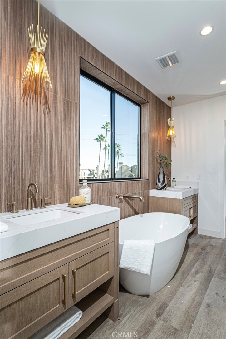328 3rd Street Huntington Beach, CA 92648 - Photo 21 of 42 a bathroom with a bathtub and a sink