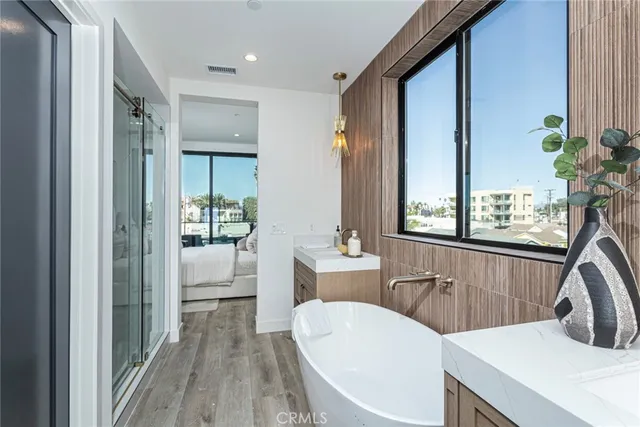 a view of a dining room with a table and chairs