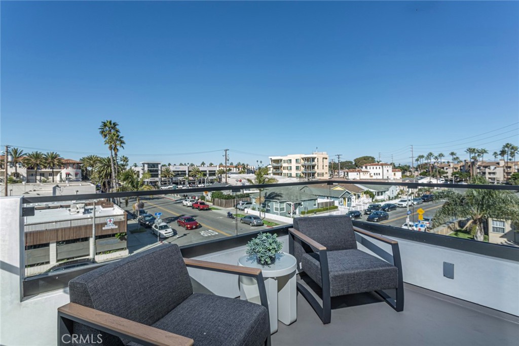 328 3rd Street Huntington Beach, CA 92648 - Photo 23 of 42 a view of a chairs and table in a terrace