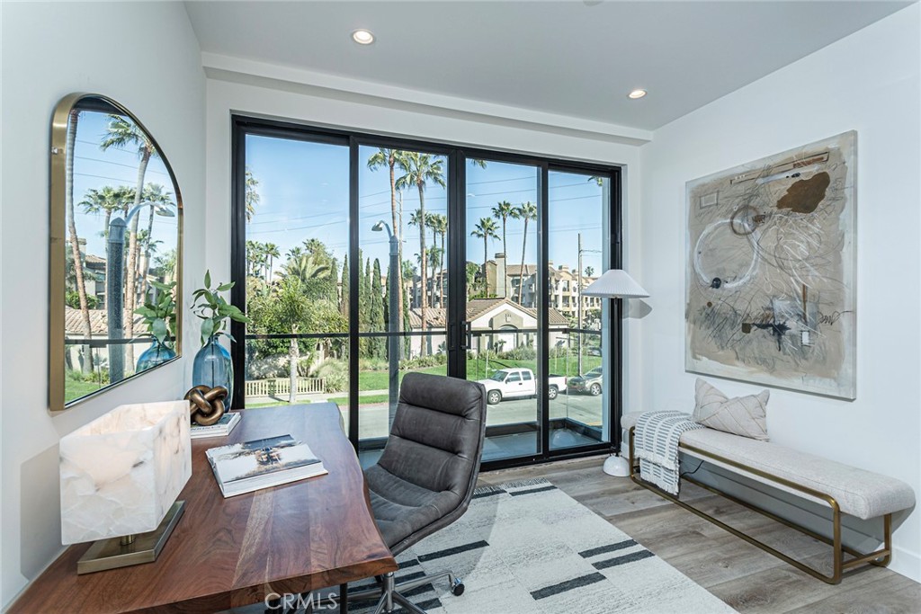 328 3rd Street Huntington Beach, CA 92648 - Photo 26 of 42 a living room with furniture and a large window