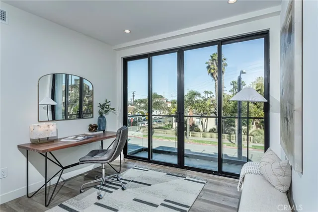 a living room with a large window and a table