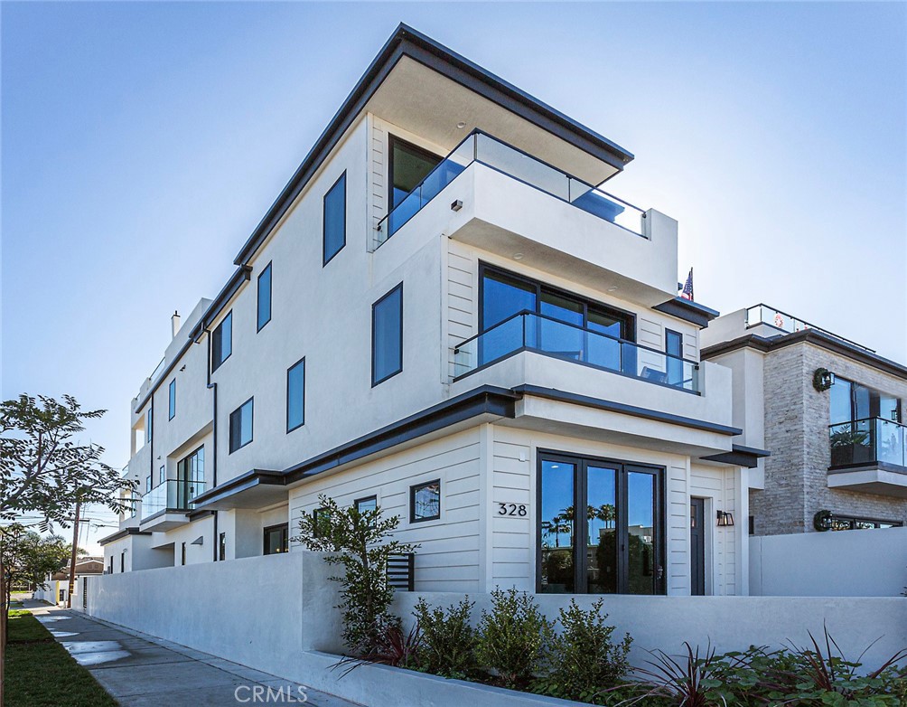 328 3rd Street Huntington Beach, CA 92648 - Photo 3 of 42 a front view of a house with a yard