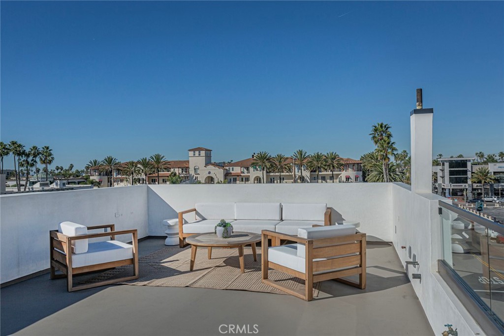 328 3rd Street Huntington Beach, CA 92648 - Photo 33 of 42 a view of a terrace with chairs