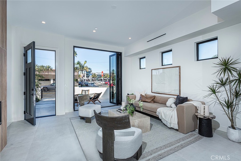 328 3rd Street Huntington Beach, CA 92648 - Photo 5 of 42 a living room with furniture and a large window