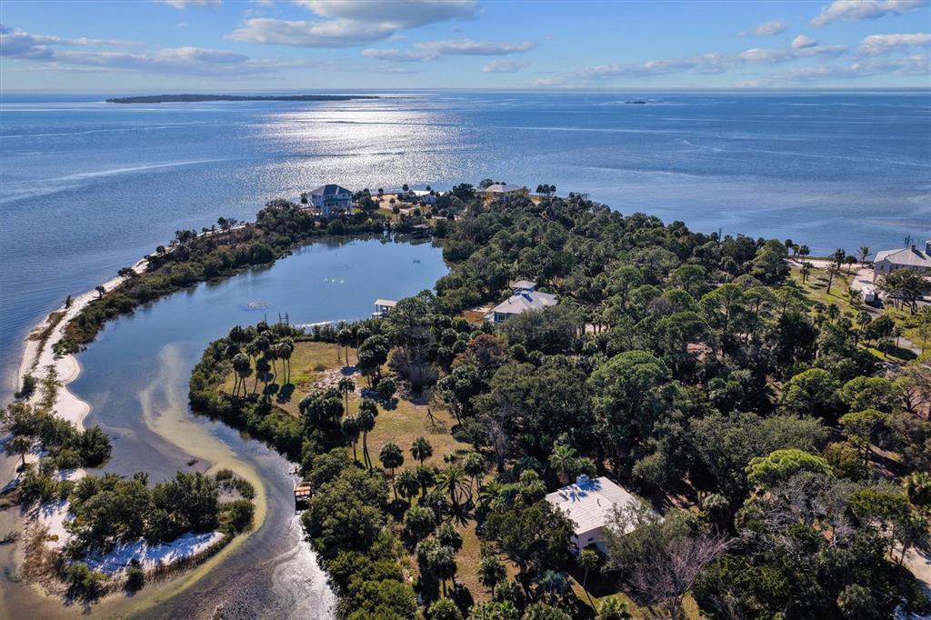 136 Southwest Sw Place Cedar Key, FL 32625 - Photo 9 of 13 a view of a lake and a mountain