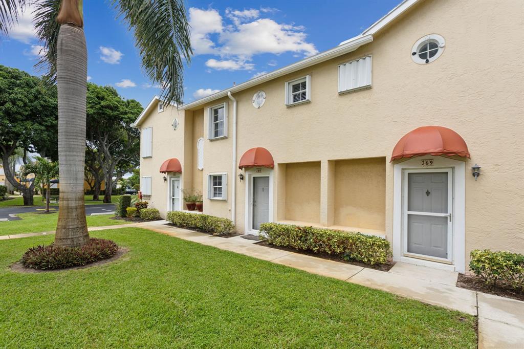 368 Waterside Drive Hypoluxo, FL 33462 - Photo 1 of 24 a view of a house with a yard and plants