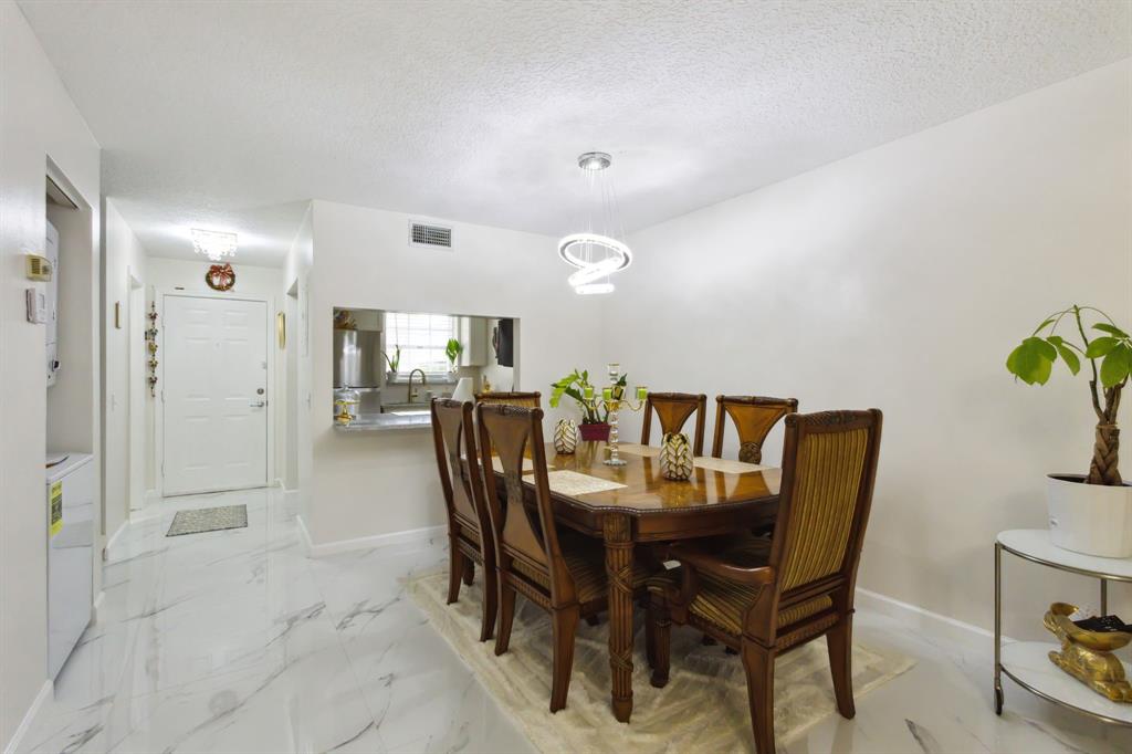 368 Waterside Drive Hypoluxo, FL 33462 - Photo 13 of 24 a dining room with furniture and window