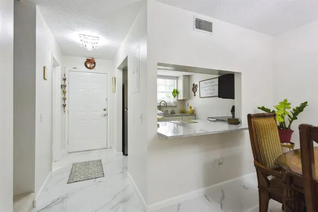 a view of kitchen with dining area