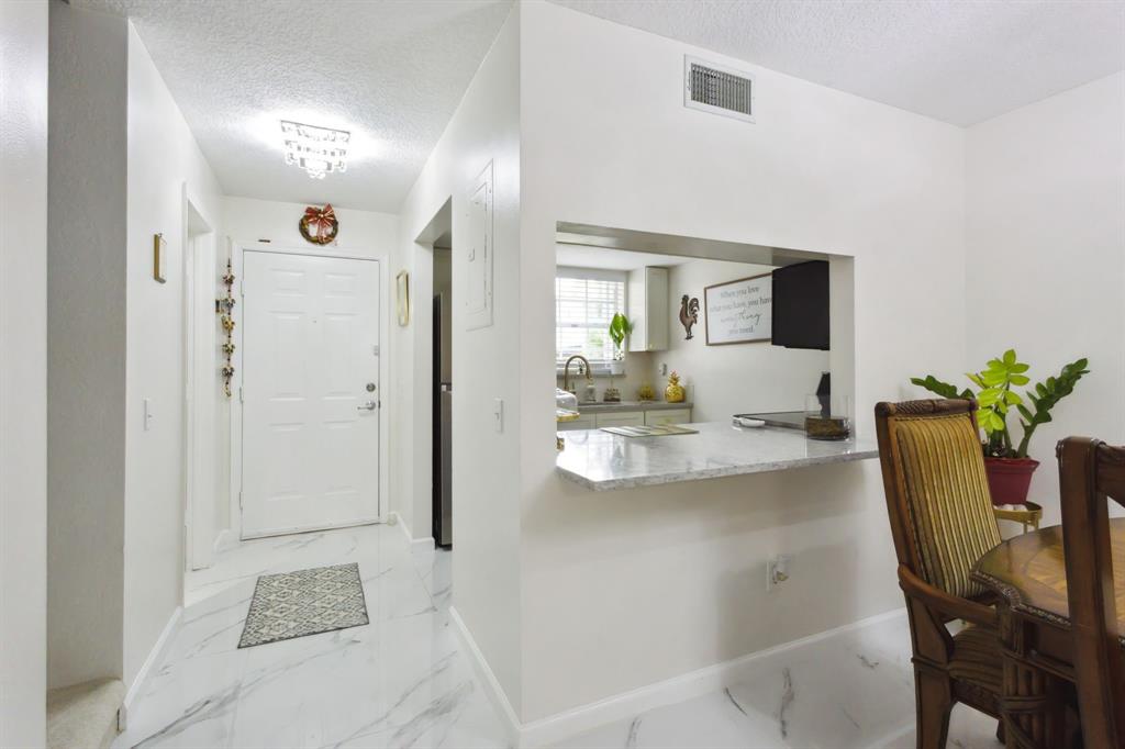 368 Waterside Drive Hypoluxo, FL 33462 - Photo 15 of 24 a view of kitchen with dining area
