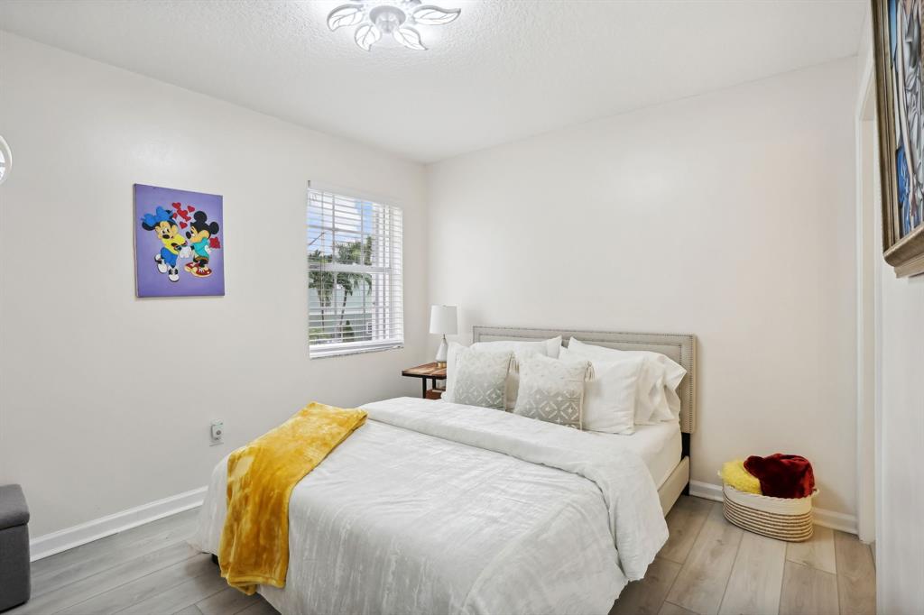 368 Waterside Drive Hypoluxo, FL 33462 - Photo 24 of 24 a bedroom with a bed and a window