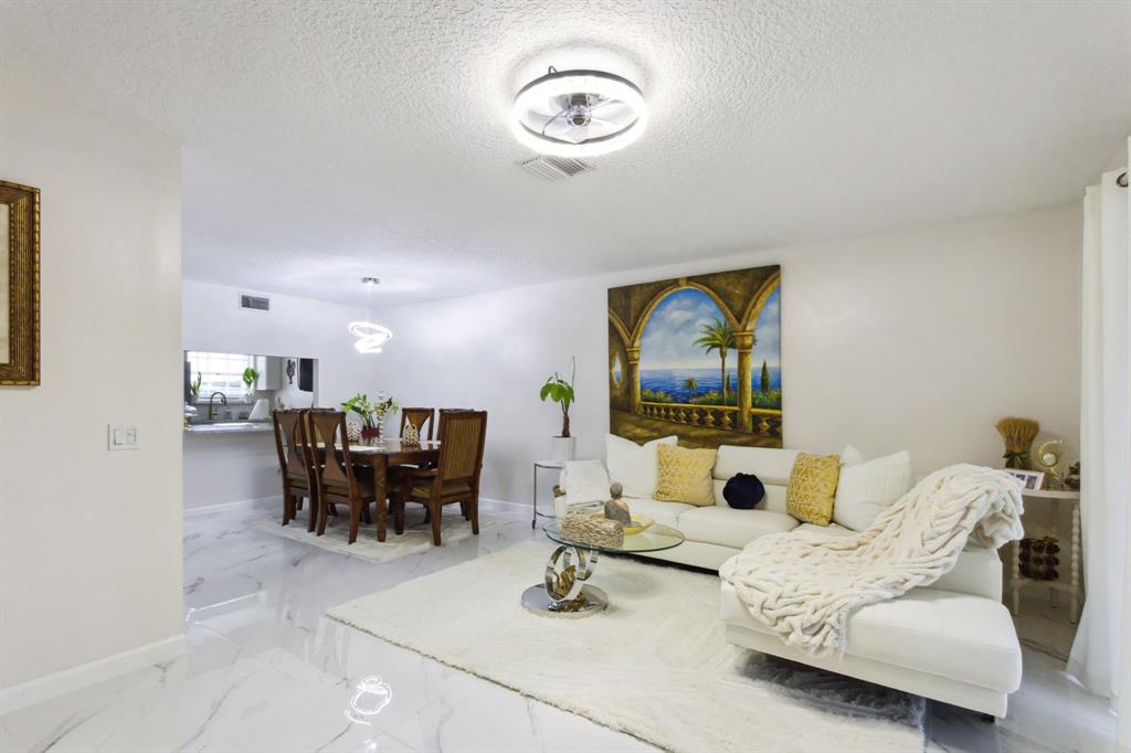 368 Waterside Drive Hypoluxo, FL 33462 - Photo 5 of 24 a living room with furniture and wooden floor