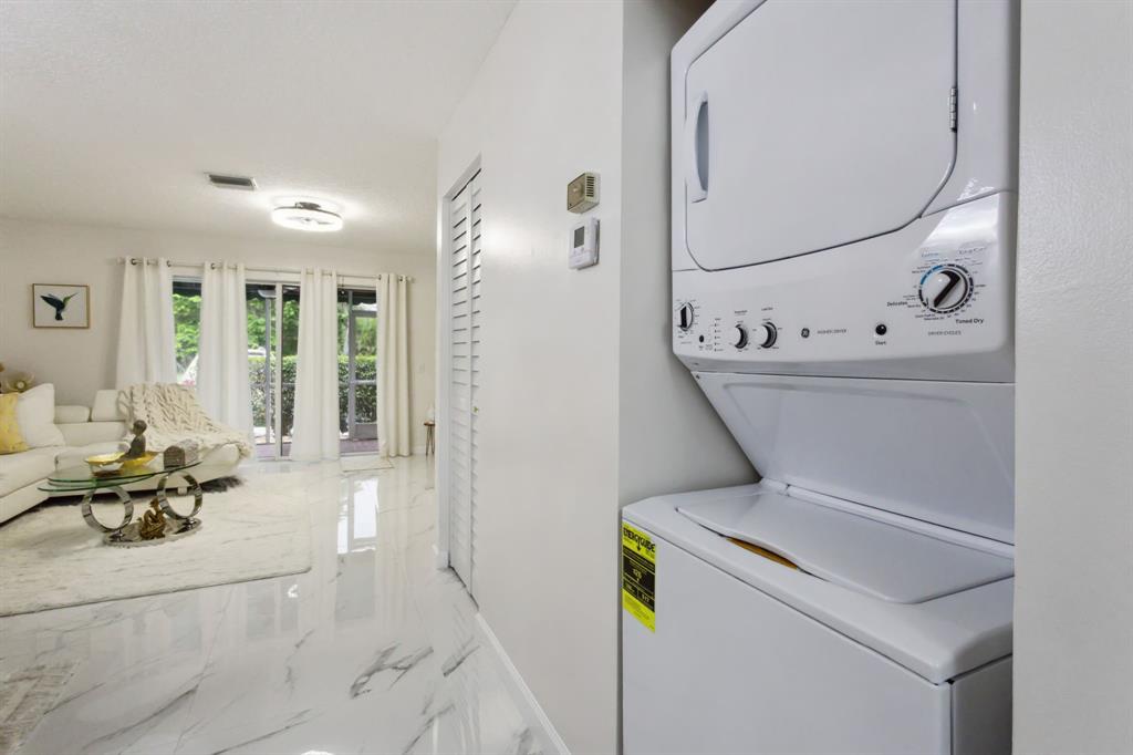 368 Waterside Drive Hypoluxo, FL 33462 - Photo 6 of 24 a living room with furniture and a table