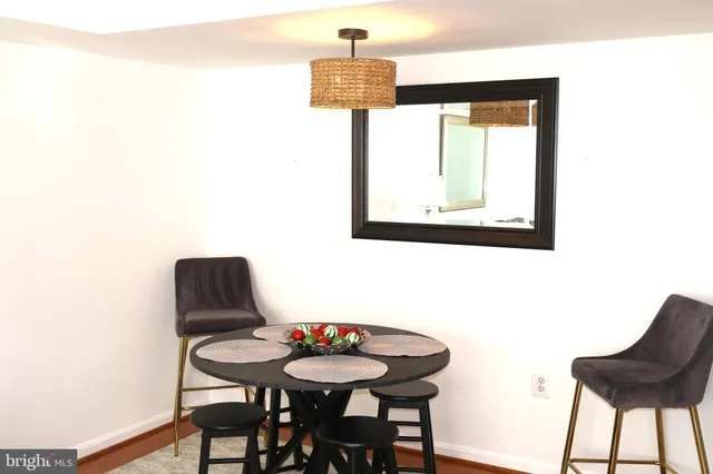 a table and chairs in a small room