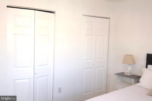 a bathroom with a shower curtain and a sink