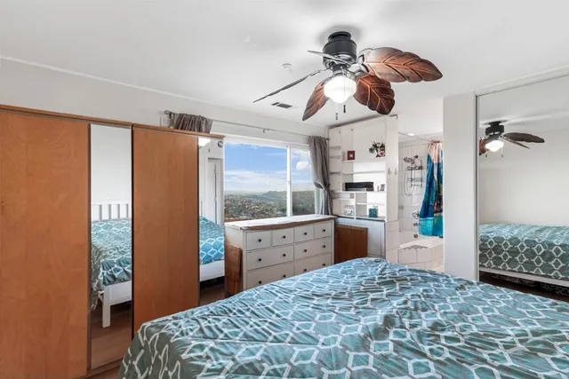 a bedroom with a bed and a dresser