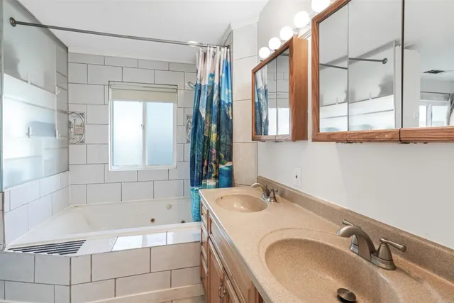 a bathroom with a sink and a bathtub