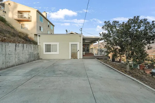 a view of a house with a yard and garage
