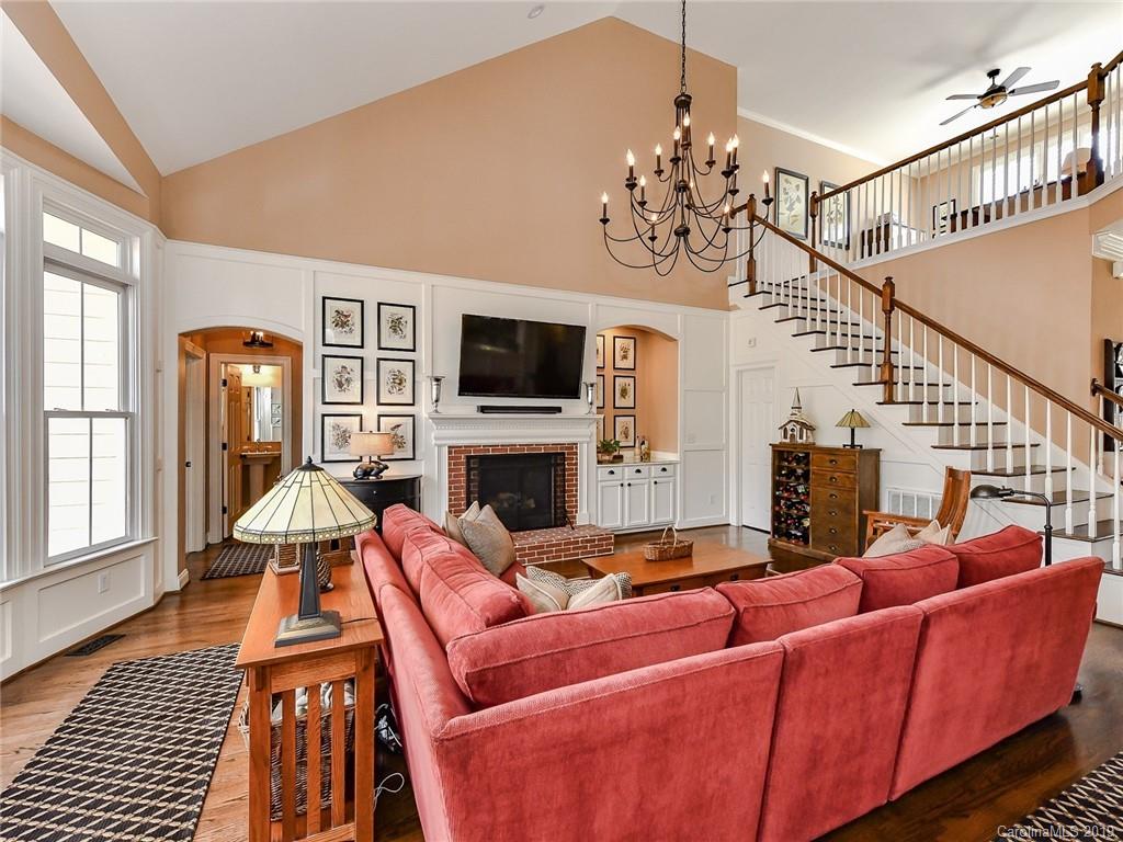 7156 Michael Scott Crossing Fort Mill, SC 29708 - Photo 22 of 36 a living room with furniture a fireplace and a flat screen tv