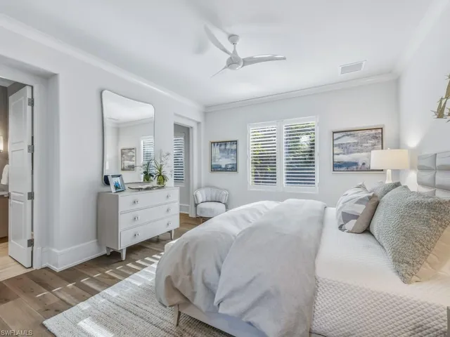 a bathroom with a toilet sink a shower and a mirror