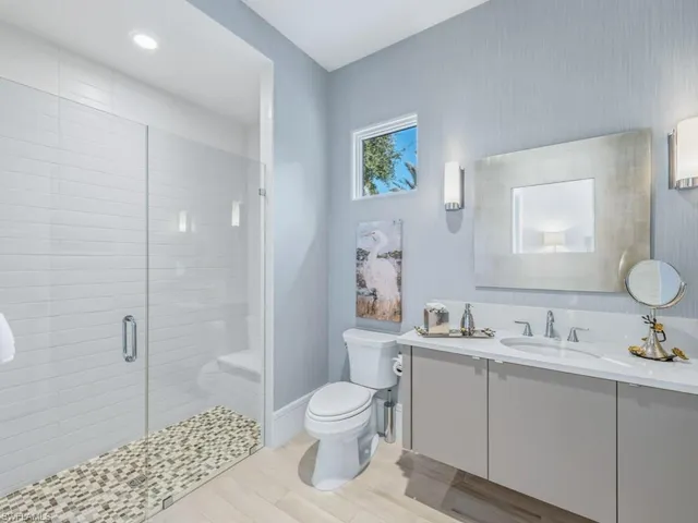 a bedroom with bed and a couch