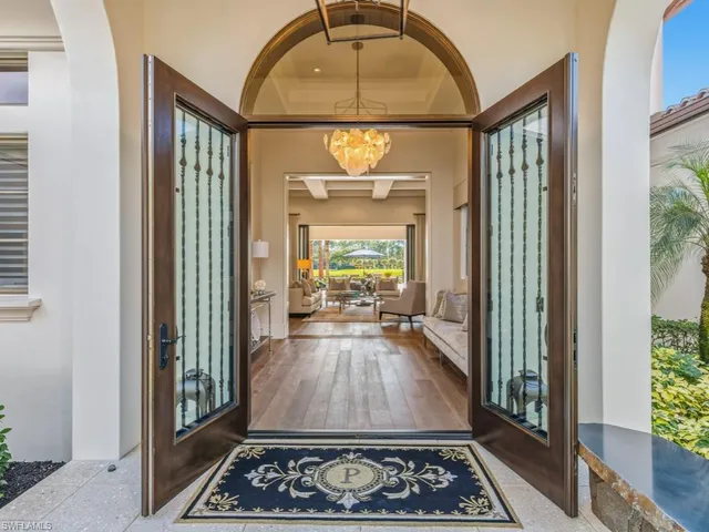 a view of a livingroom with furniture window wooden floor and a fireplace