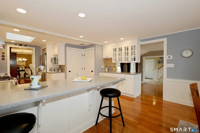 a kitchen with a table and chairs in it