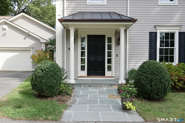 a front view of a house with garden