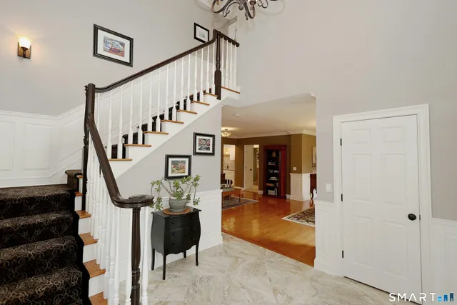 a view of entryway livingroom and hall with wooden floor