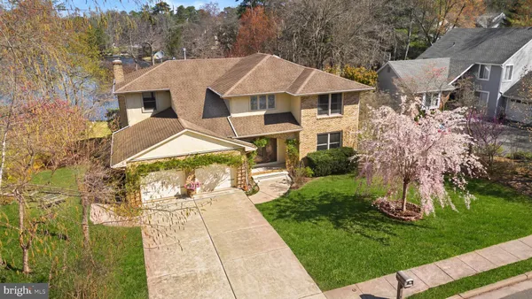 a aerial view of a house with a yard