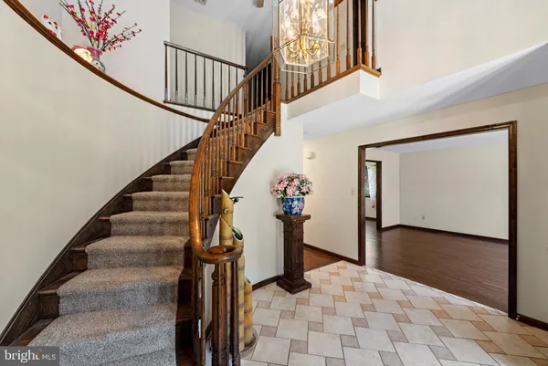 a room with a walk in closet and wooden floor