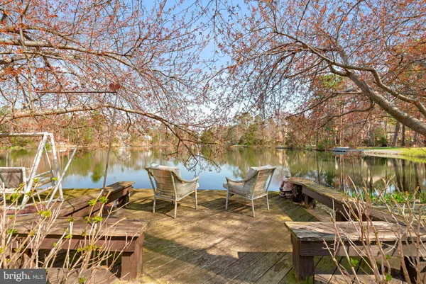 a view of a lake with a house in the background