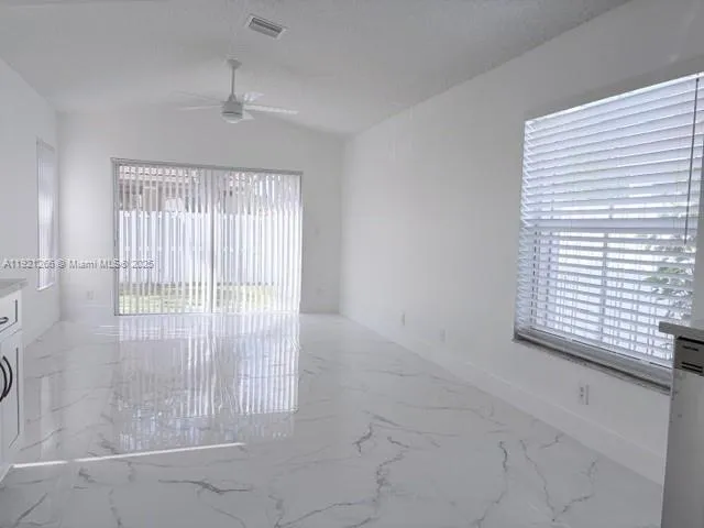 a bathroom with a shower and a sink