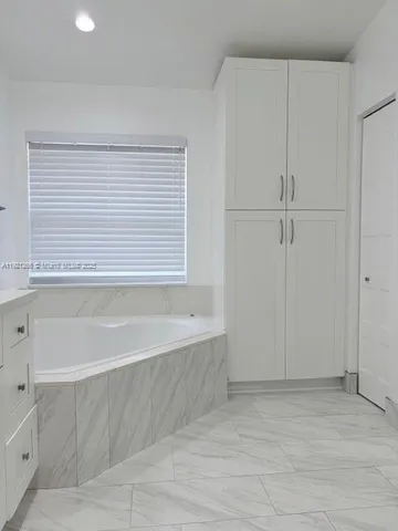 a bathroom with a shower and toilet