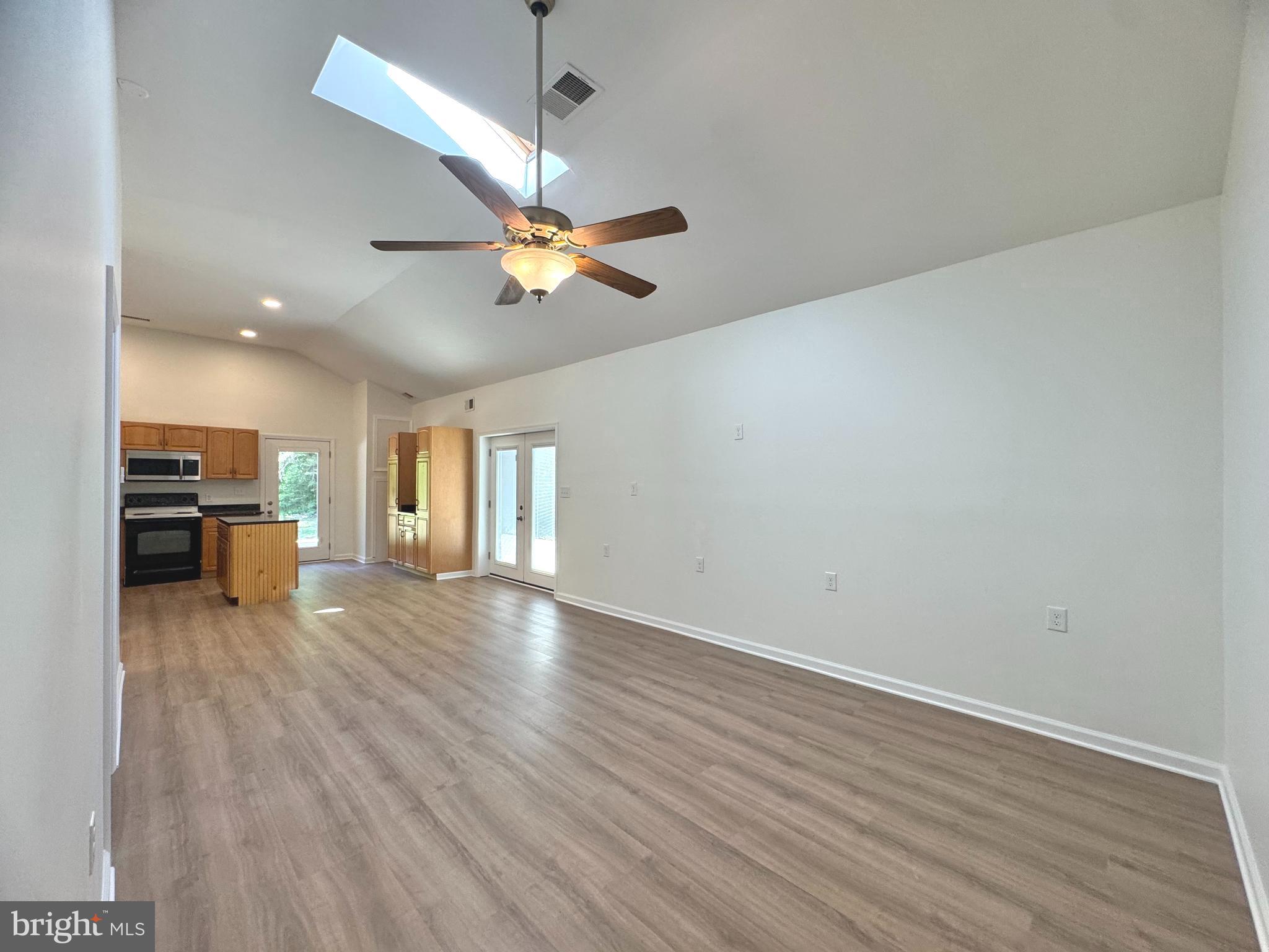 8190 Marshall Corner Road Pomfret, MD 20675 - Photo 20 of 28 wooden floor in an empty room with a window