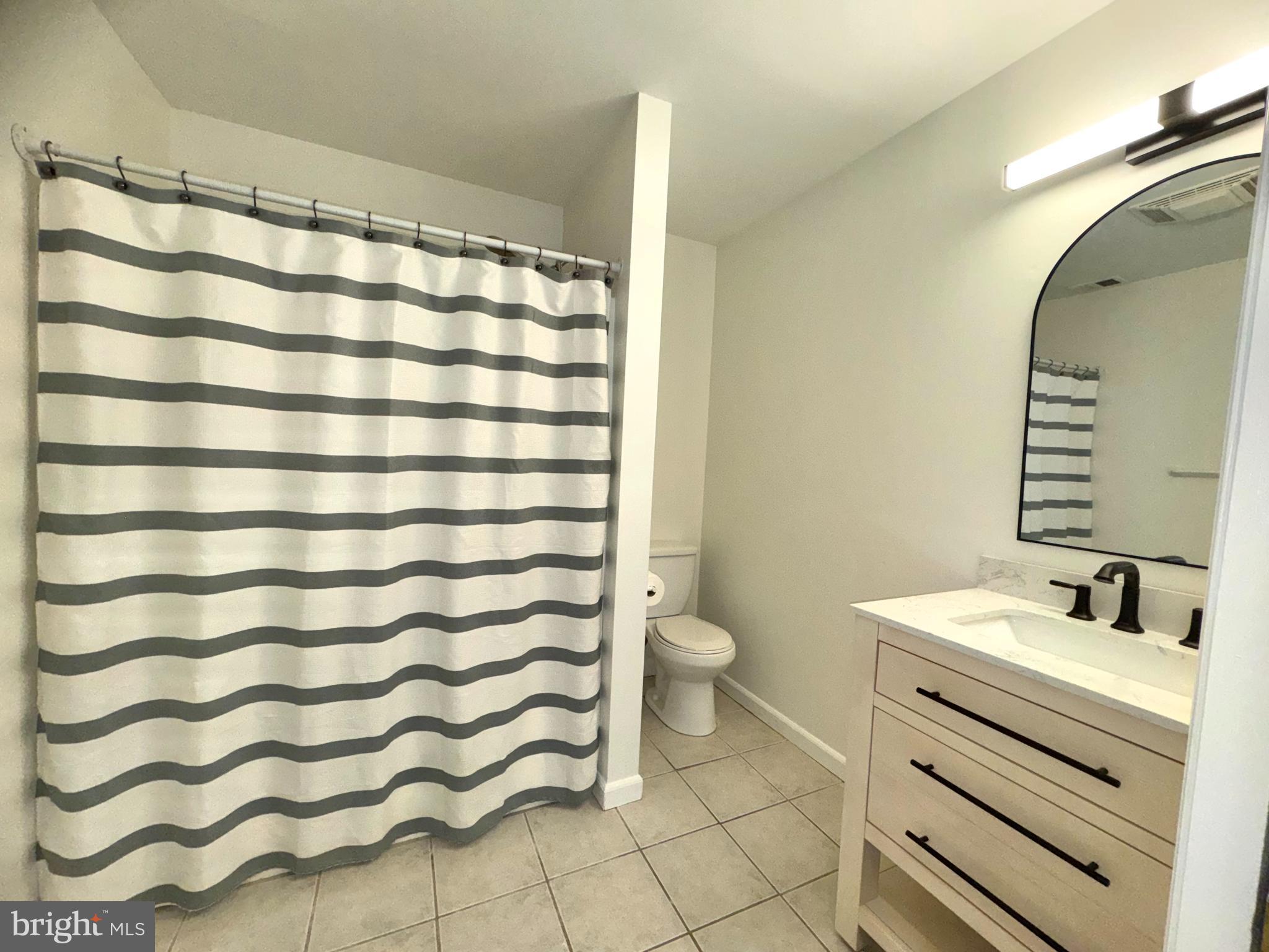 8190 Marshall Corner Road Pomfret, MD 20675 - Photo 3 of 28 a bathroom with a sink and a mirror