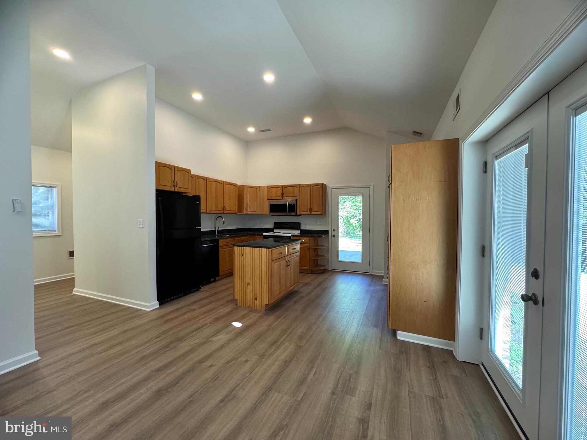 8190 Marshall Corner Road Pomfret, MD 20675 - Photo 4 of 28 a view of kitchen with stainless steel appliances kitchen island wooden cabinets and granite counter tops