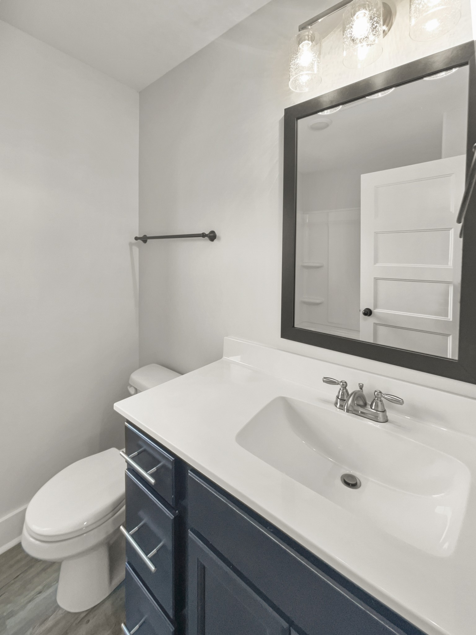 1672 Rains Road Clarksville, TN 37042 - Photo 21 of 23 a bathroom with a sink a toilet and mirror
