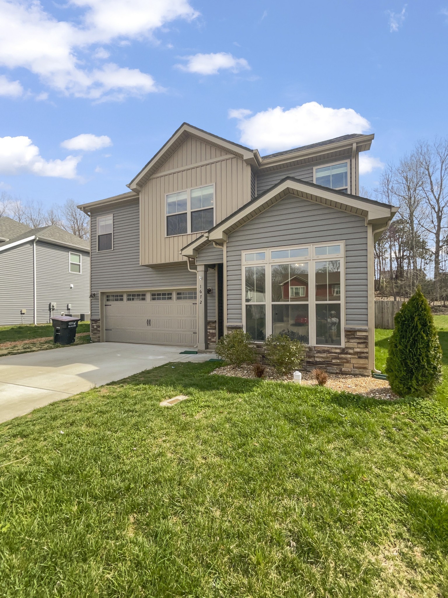 1672 Rains Road Clarksville, TN 37042 - Photo 6 of 23 a front view of a house with a yard